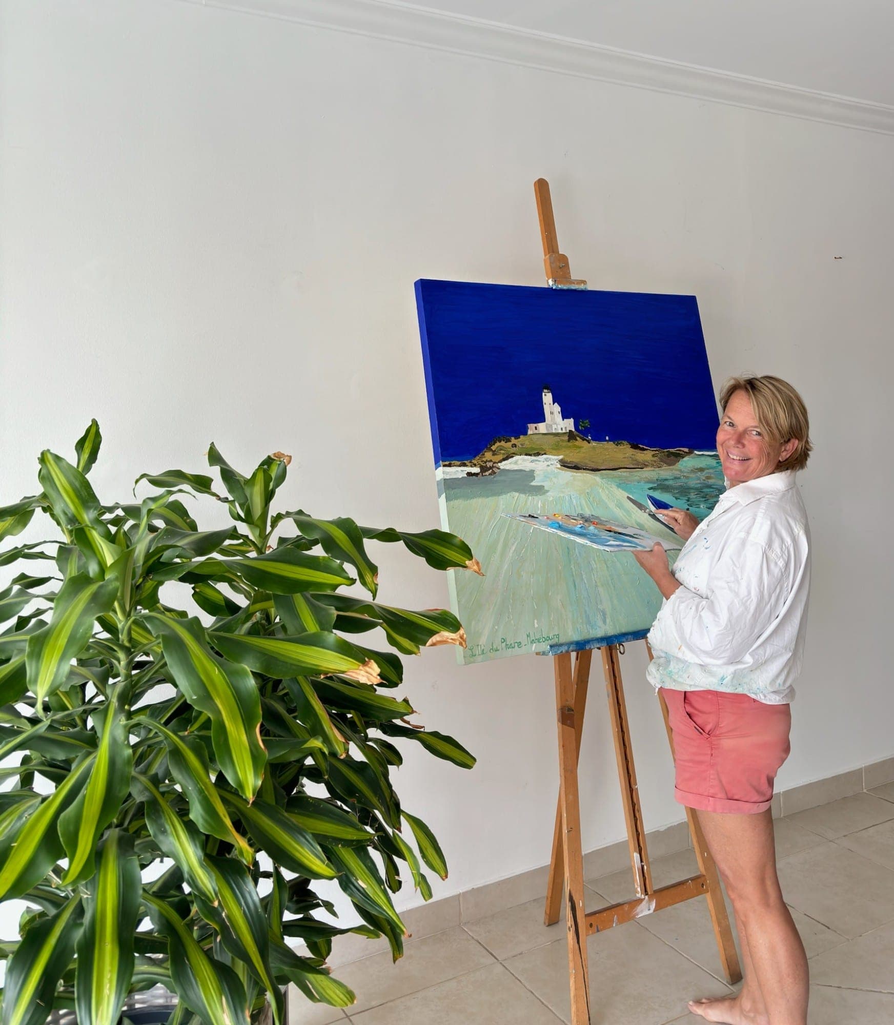Nathalie Wright at her easel, palette in hand